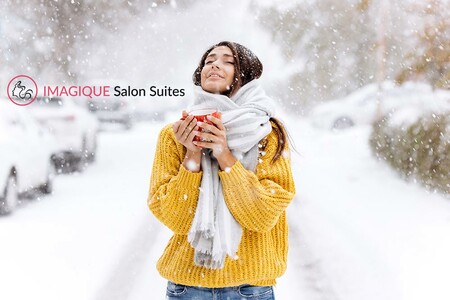 Lady standing in snow on a winter day with her hair out